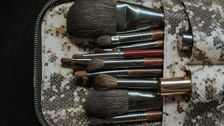 Makeup brushes arranged in a patterned brush pouch