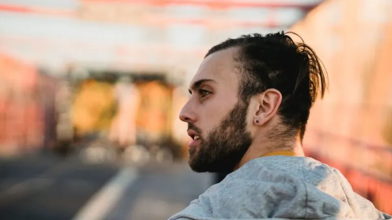 Man with neatly styled glossy hair in profile