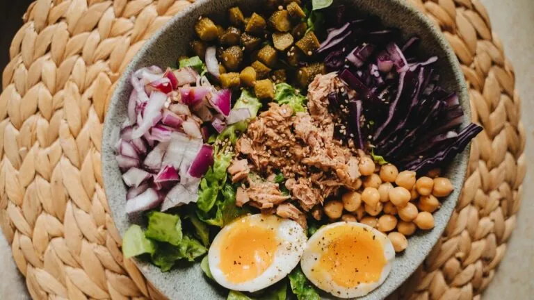 Bowl of boiled eggs, chickpeas, tuna and salad