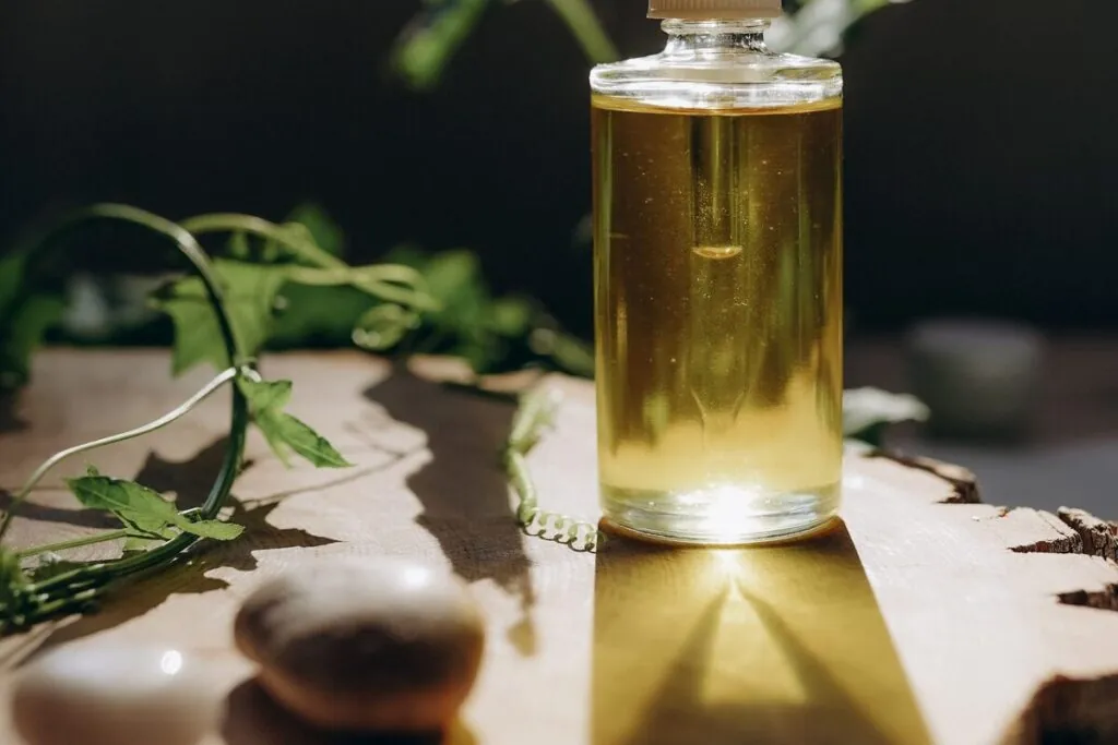 Herbal hair oil in a glass bottle