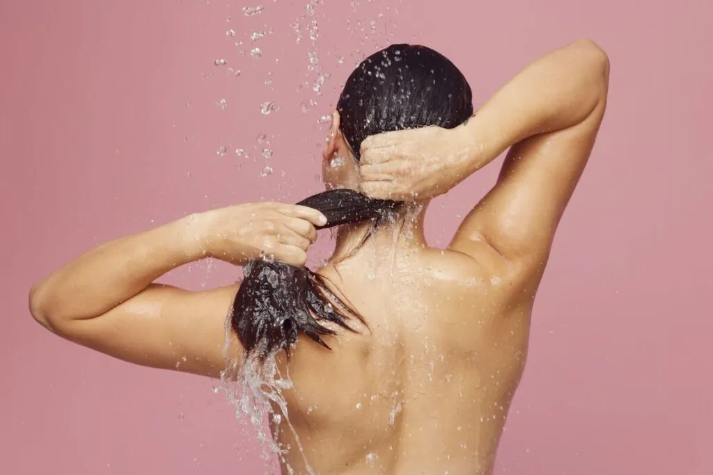 Woman rinsing her hair in the shower