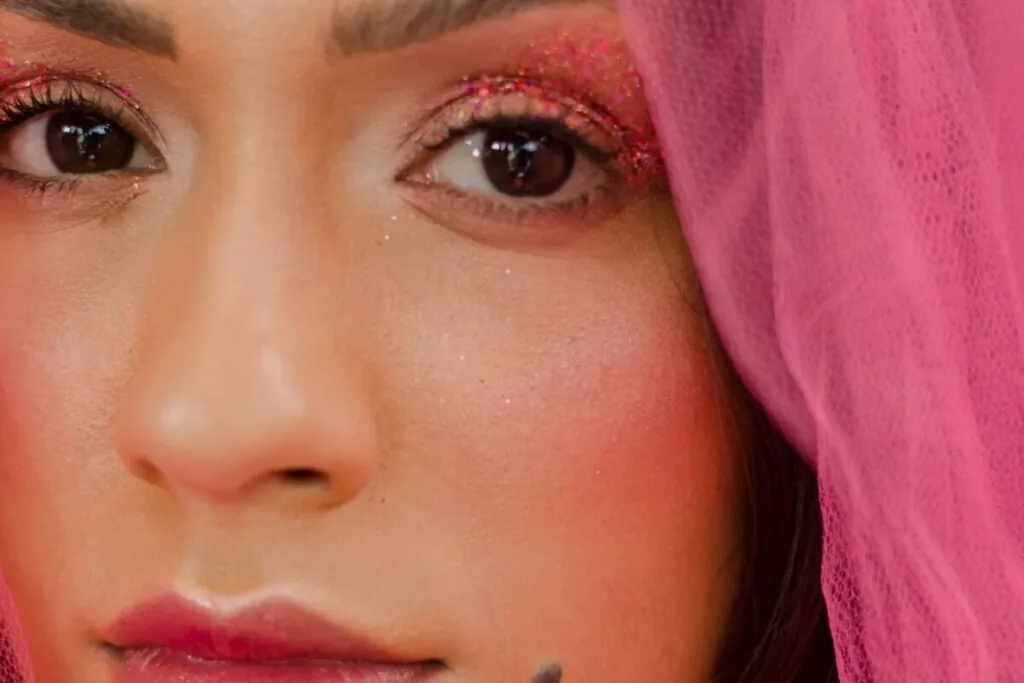 Woman with soft pink eye makeup and lips